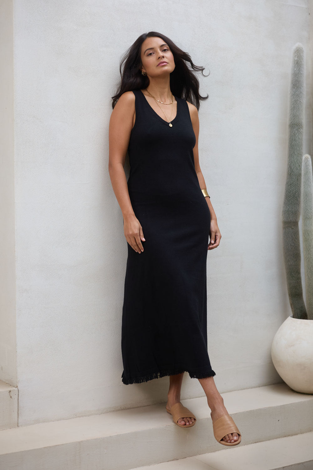 Model Tahnee wearing size S of the Feeling Mighty Fine Fringe Hem Knit Maxi Dress in colour Black (Black), from the front, showing the whole outfit