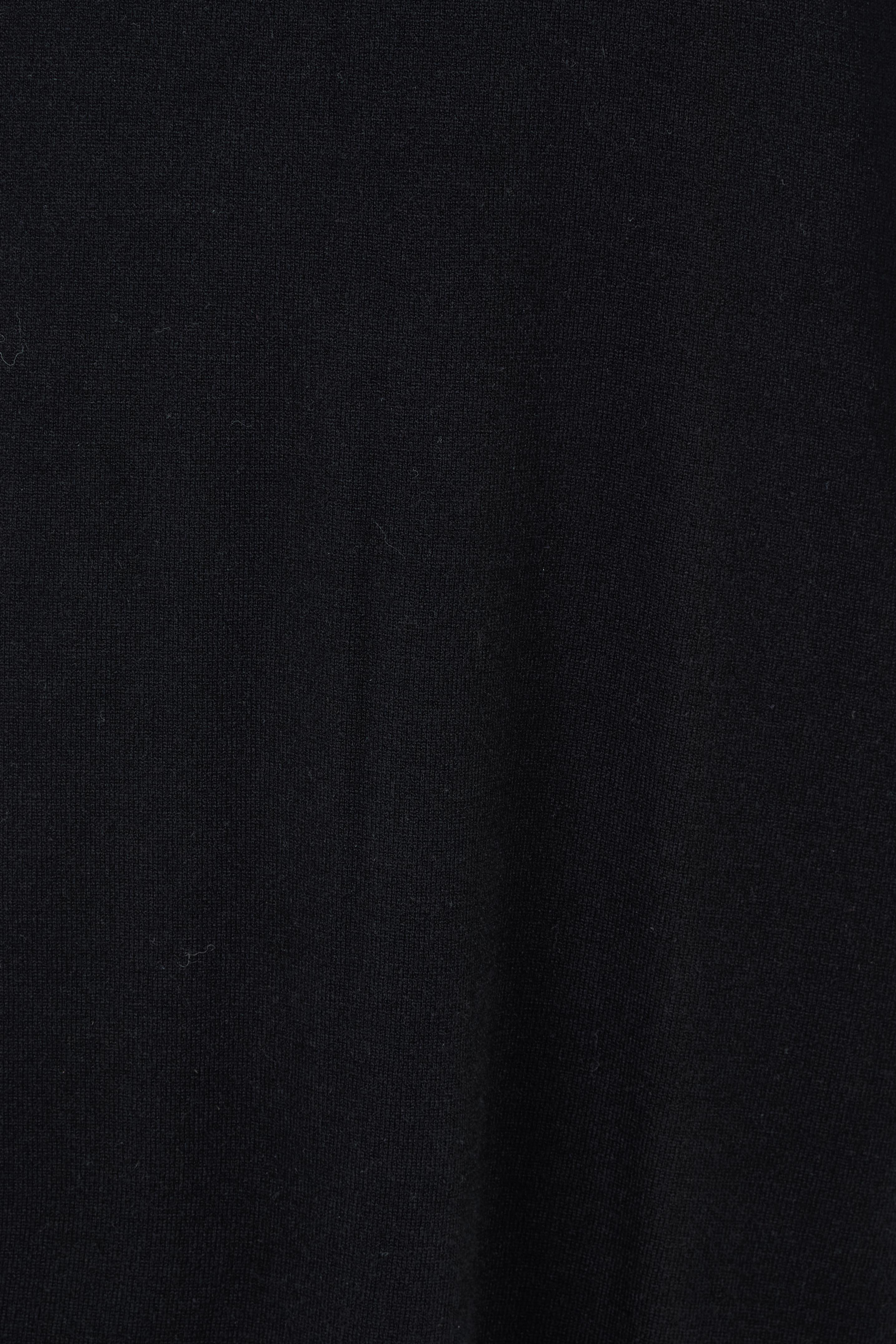 Product shot of the Feeling Mighty Fine Fringe Hem Knit Maxi Dress in colour Black (Black), detail