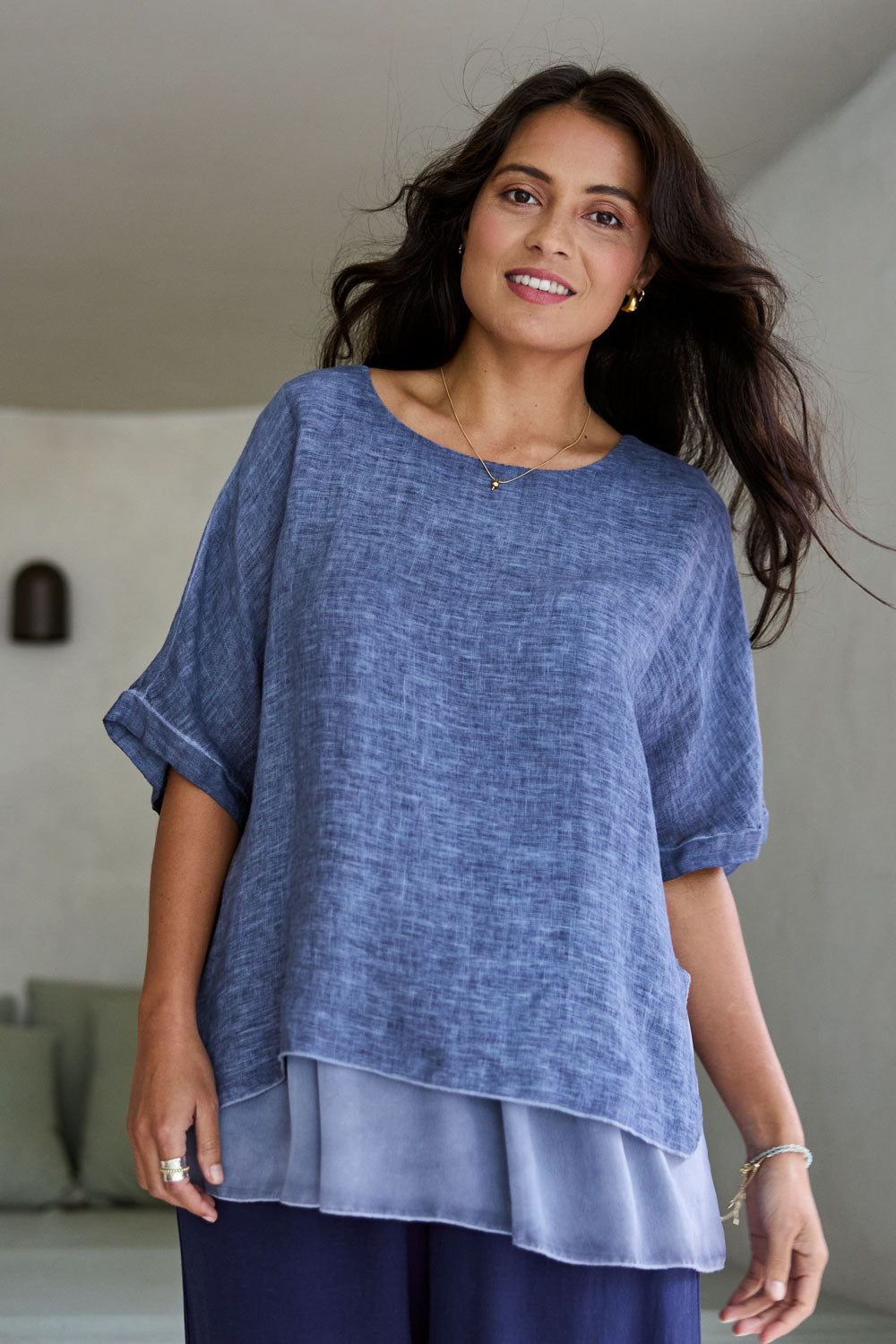 Model Tahnee wearing size 10 of the Layers Of Love Linen Overlay Top in colour Denim (Blue), from the front, showing the whole outfit
