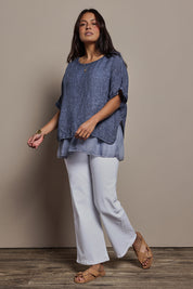 Model Tahnee wearing size 10 of the Layers Of Love Linen Overlay Top in colour Denim (Blue), from the front, showing the whole outfit