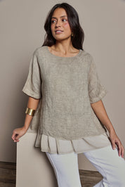 Model Tahnee wearing size 10 of the Layers Of Love Linen Overlay Top in colour Mocha, from the front, cropped image