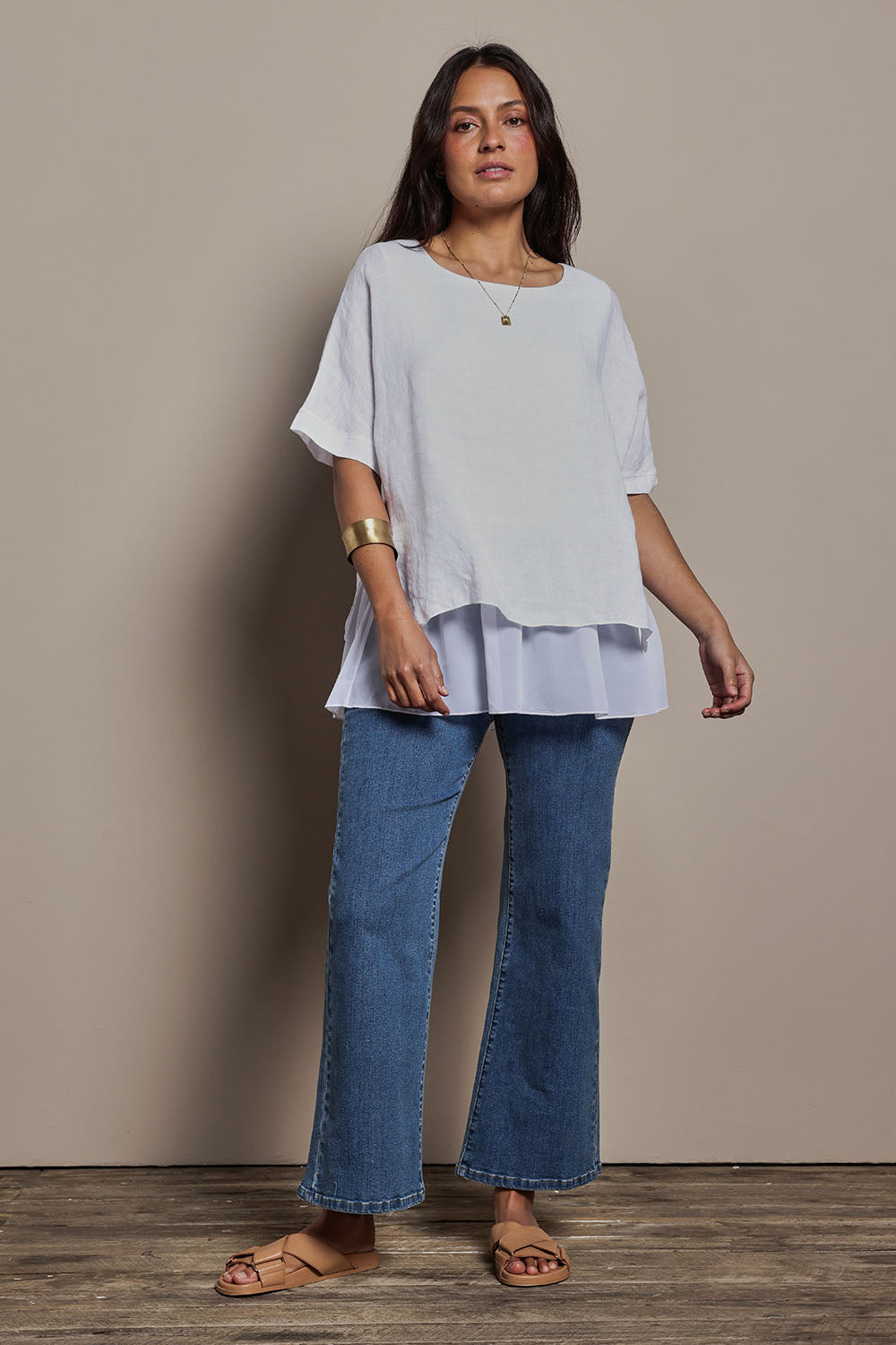 Model Tahnee wearing size 10 of the Layers Of Love Linen Overlay Top in colour White (White), from the front, showing the whole outfit