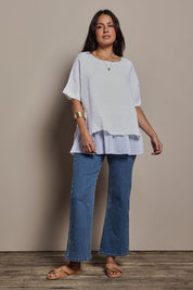 Model Tahnee wearing size 10 of the Layers Of Love Linen Overlay Top in colour White (White), from the front, showing the whole outfit