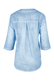 Product shot of the Cool Ease Embroidered Cotton Shirt – Denim in colour Denim, from the back