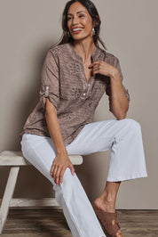Model Amanda wearing size 10 of the Cool Ease Embroidered Cotton Shirt in colour Latte, from the front, cropped image