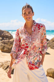 Model Tegan wearing size 10 of the Garden Glory Tab Sleeve Shirt in colour Pinkfleur, from the front, showing the whole outfit