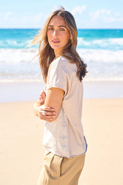 Model Tegan wearing size 10 of the Go To Contrast Back Linen Top in colour Natural, from the front, showing the whole outfit