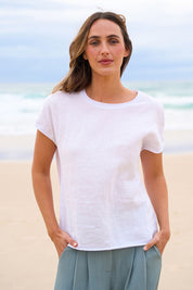 Model Tegan wearing size 10 of the Go To Contrast Back Linen Top in colour White (White), from the front, showing the whole outfit