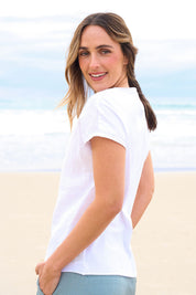 Model Tegan wearing size 10 of the Go To Contrast Back Linen Top in colour White (White), from the front, showing the whole outfit