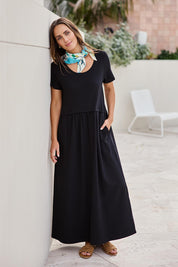 Model Tegand wearing size 10 of the Casual Saturday Dress - Black in colour Black, from the front