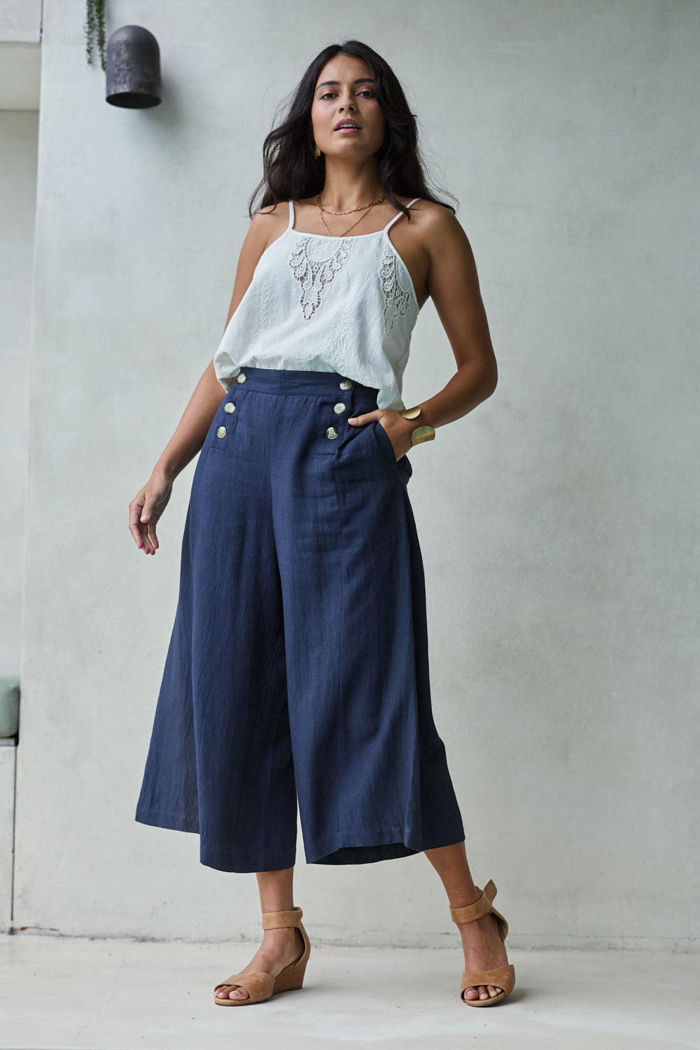 Model Tahnee wearing size 10 of the Sail Away With Me Pants in colour Navy (Blue), from the front, showing the whole outfit
