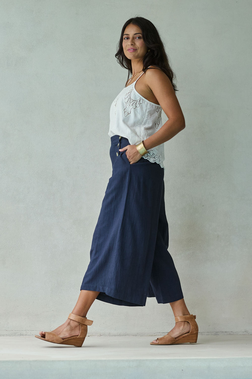 Model Tahnee wearing size 10 of the Sail Away With Me Pants in colour Navy (Blue), from the front, showing the whole outfit