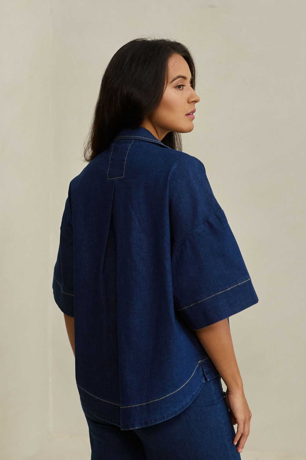 Model Tahnee wearing size 10 of the Always There For Me Denim Shirt Jacket in colour Denim (Blue), from the front, showing the whole outfit