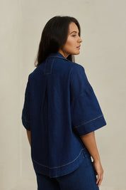 Model Tahnee wearing size 10 of the Always There For Me Denim Shirt Jacket in colour Denim (Blue), from the front, showing the whole outfit