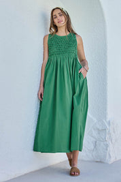 Model Tegand wearing size 10 of the Summer Breeze Smocked Cotton Dress – Green in colour Green, from the front