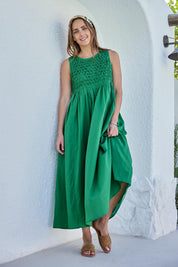 Model Tegand wearing size 10 of the Summer Breeze Smocked Cotton Dress – Green in colour Green, from the front