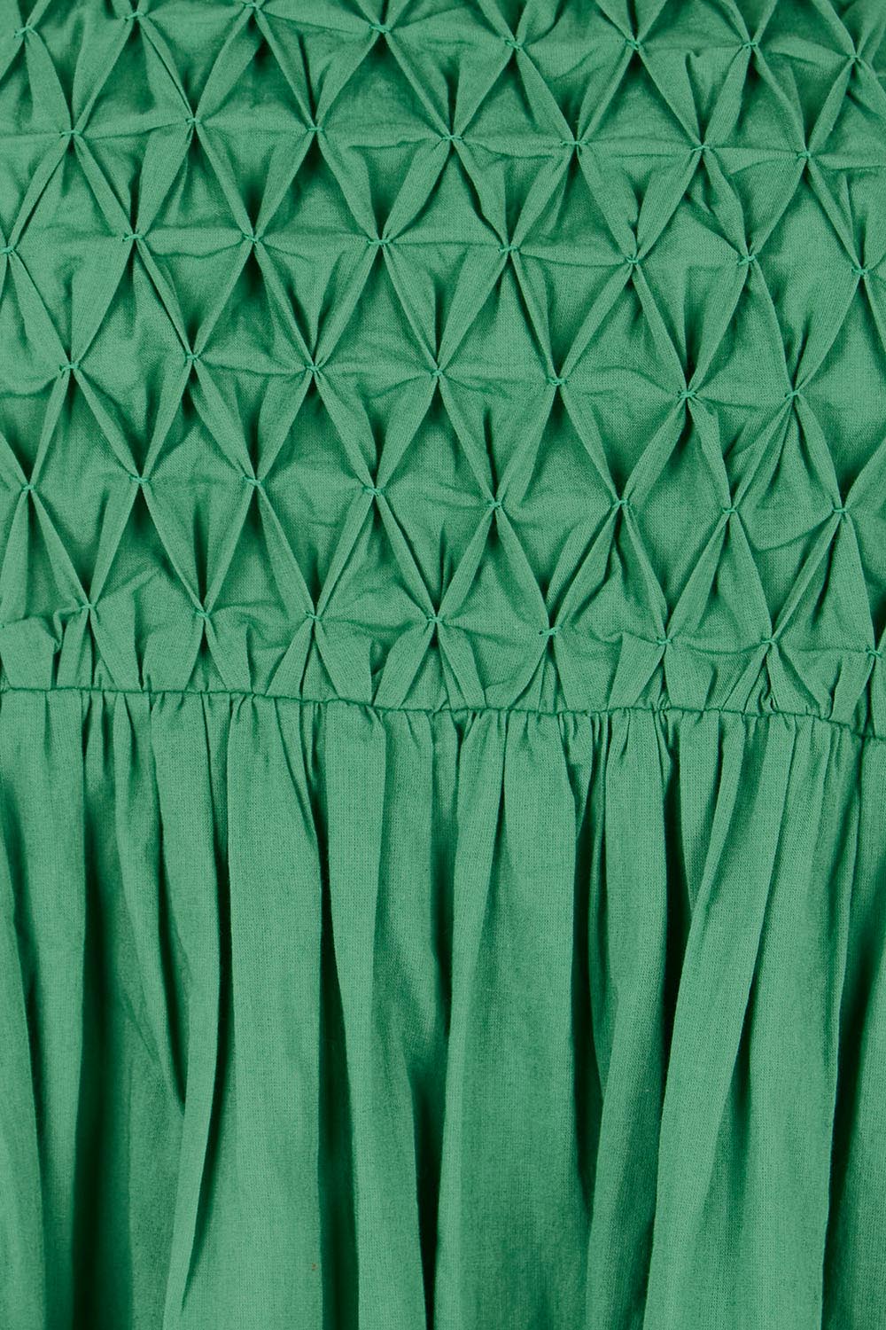 Product shot of the Summer Breeze Smocked Cotton Dress – Green in colour Green, showing detail
