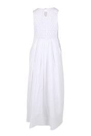 Product shot of the Summer Breeze Smocked Cotton Dress – White in colour White, from the back
