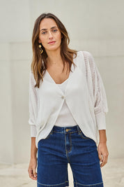 Model Tegand wearing size 10 of the Summer Haze Cardigan – White in colour White, in a cropped view
