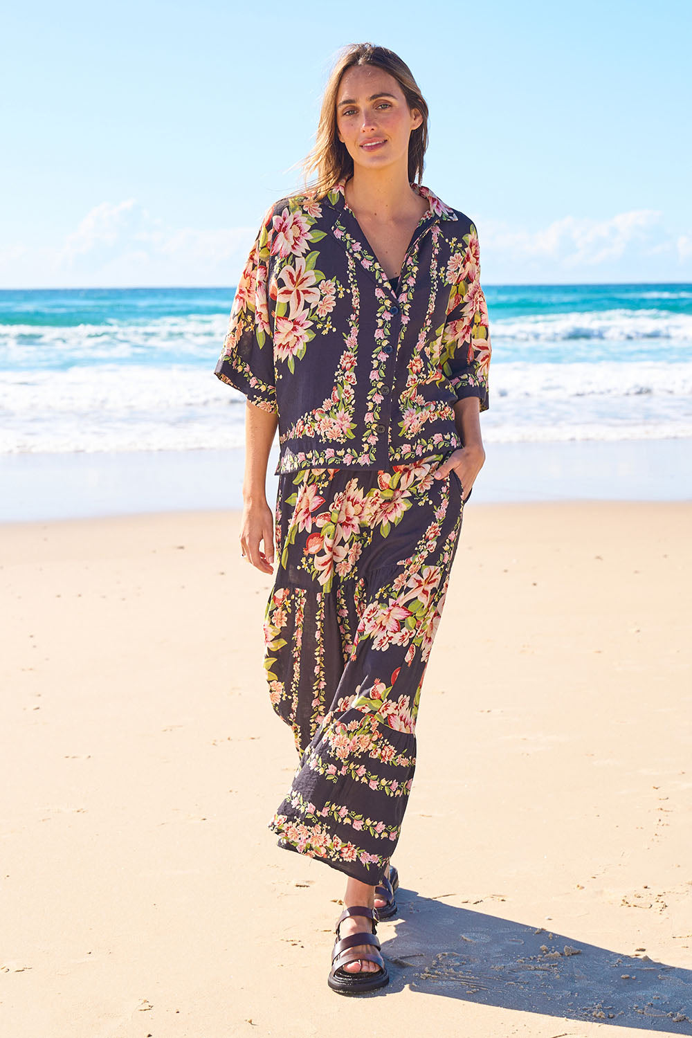 Model Tegan wearing size 10 of the Floral Affair Shirt in colour Blkfleur (Black), from the front, showing the whole outfit