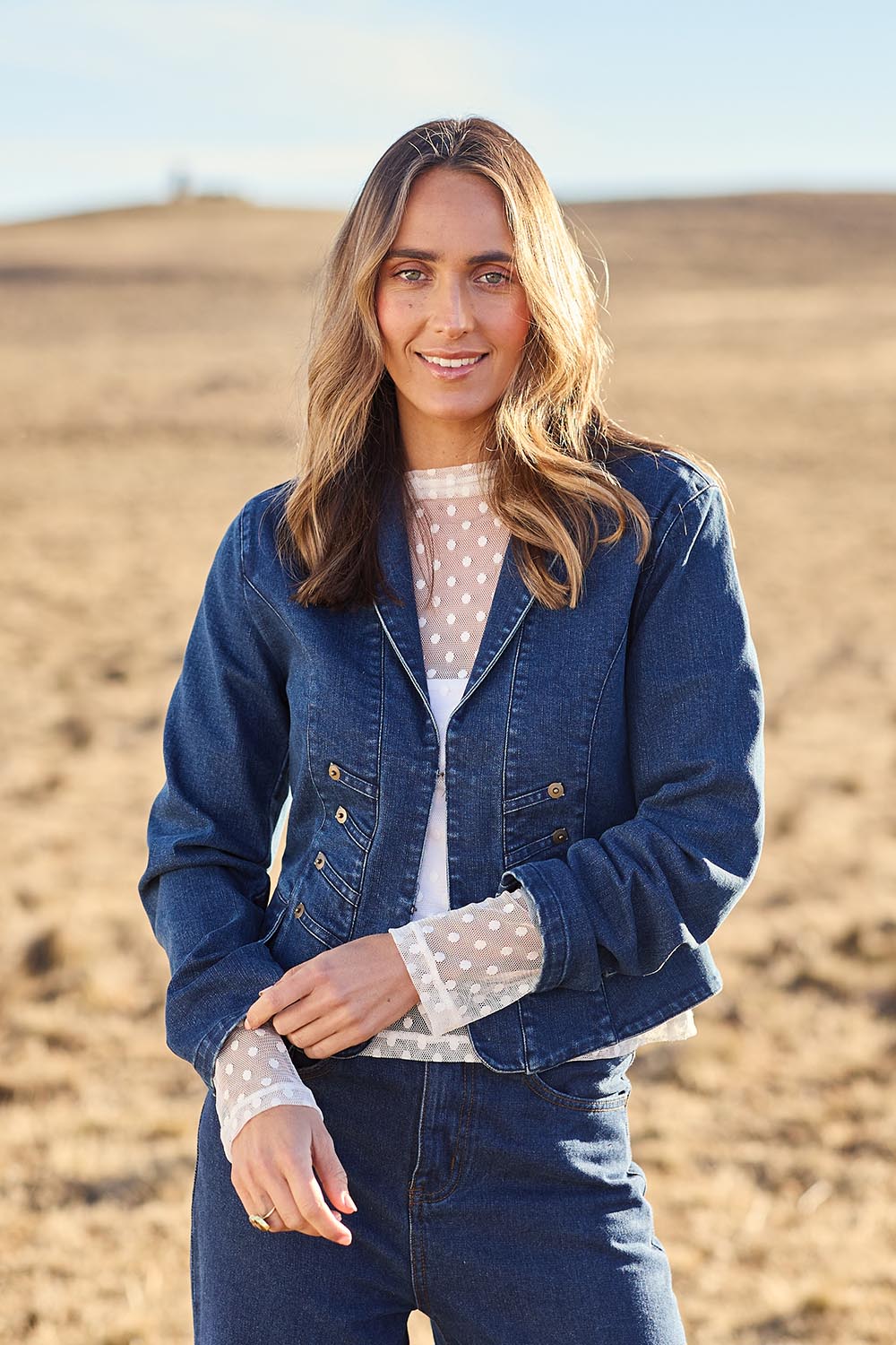 Model Tegan wearing size 10 of the You Have My Attention Denim Jacket in colour Denim (Blue), from the front, showing the whole outfit