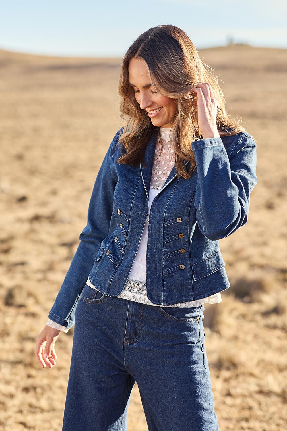 Model Tegan wearing size 10 of the You Have My Attention Denim Jacket in colour Denim (Blue), from the front, showing the whole outfit
