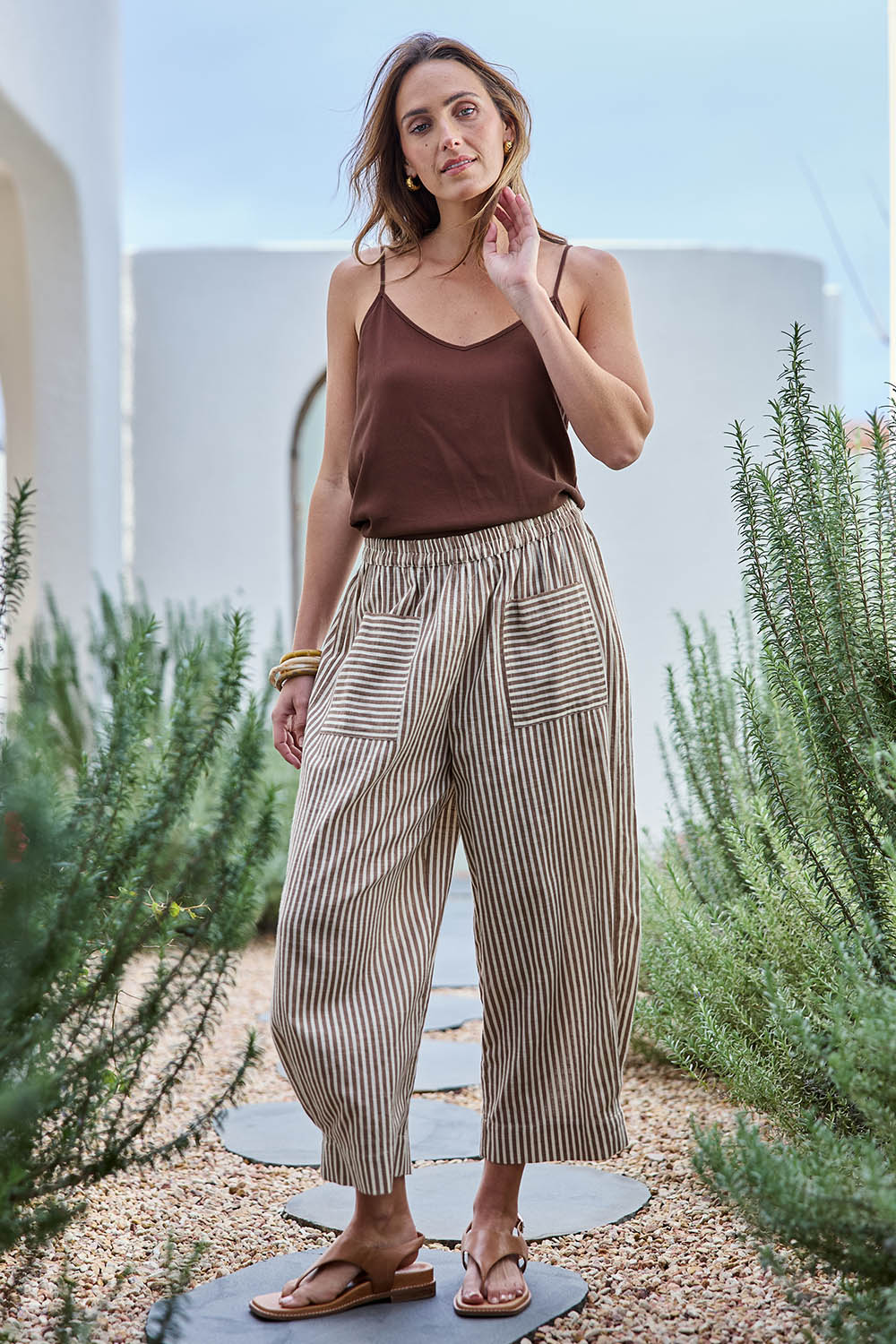 Model Tegand wearing size 10 of the Beach Wandering Cotton Pants – Chocstripe in colour Chocstripe, from the front