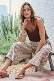 Model Tegand wearing size 10 of the Beach Wandering Cotton Pants – Chocstripe in colour Chocstripe, from the front