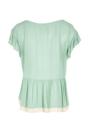 Product shot of the Morning Sunlight Embroidered Blouse – Pistachio in colour Pistachio, from the back