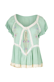 Product shot of the Morning Sunlight Embroidered Blouse – Pistachio in colour Pistachio, from the front