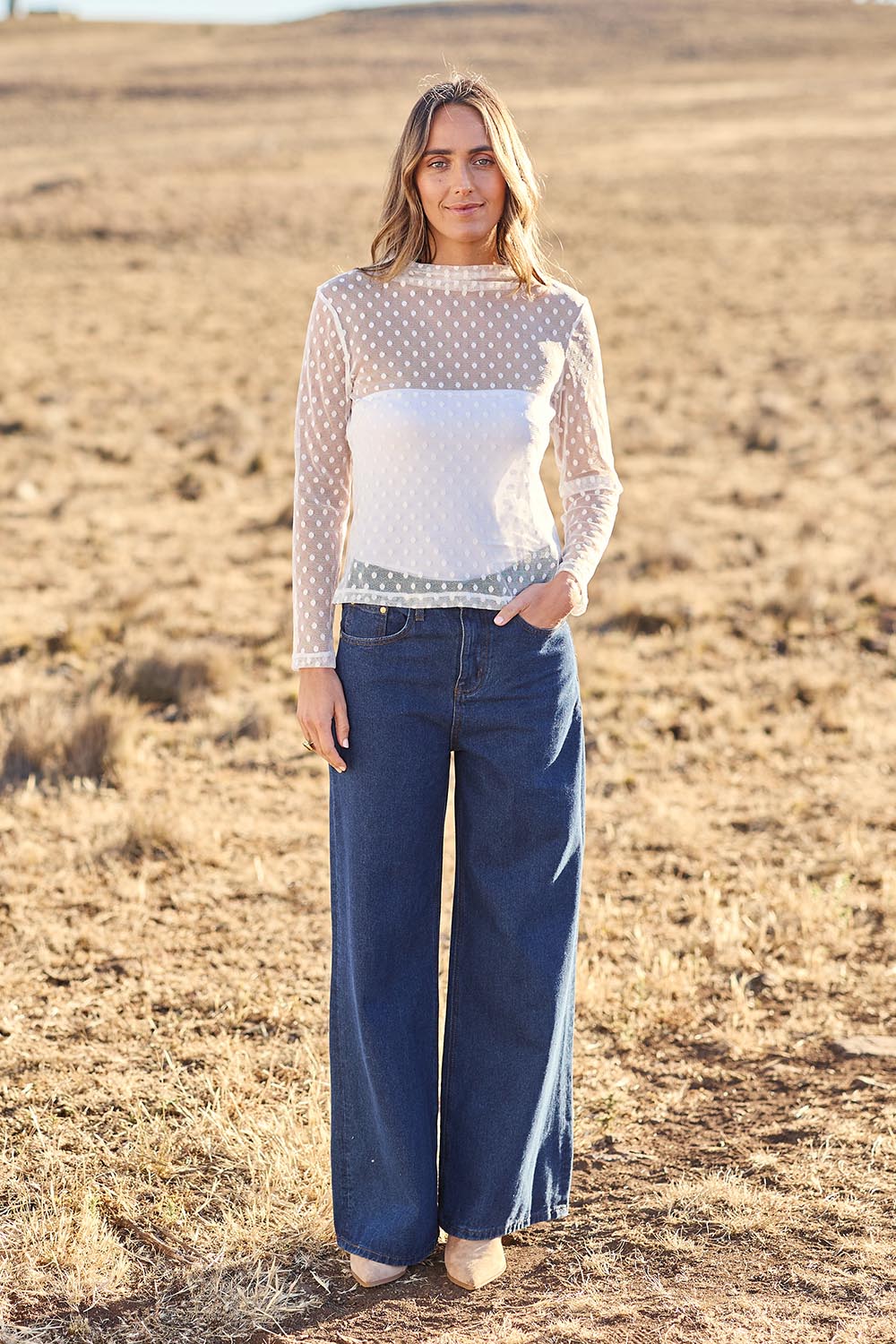 Model Tegan wearing size 10 of the Layer Me Up Lace Mesh Long Sleeve Top in colour White (White), from the front, showing the whole outfit