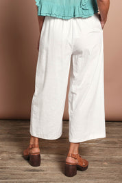 Model Riina wearing size 10 of the Pocket Full Of Sunshine Cotton Blend  3/4 Pants in colour White (White), from the back