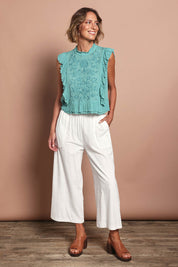 Model Riina wearing size 10 of the Pocket Full Of Sunshine Cotton Blend  3/4 Pants in colour White (White), from the front, showing the whole outfit