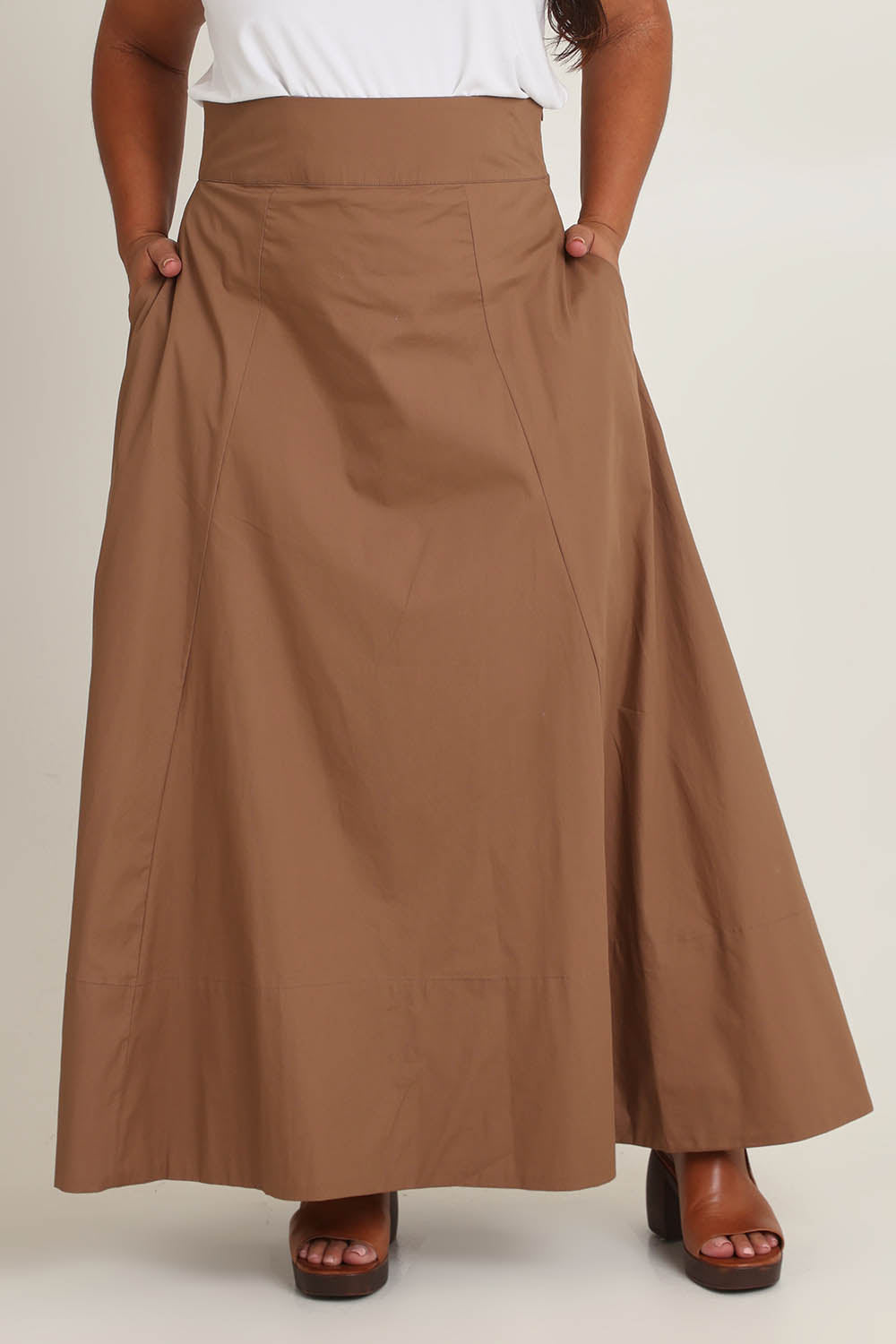 Model Ashleigh wearing size 16 of the Timeless Love Cotton Maxi Skirt in colour Dune, from the front, cropped image