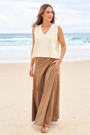Model Tegan wearing size 10 of the Timeless Love Cotton Maxi Skirt in colour Dune, from the front, showing the whole outfit