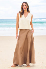 Model Tegan wearing size 10 of the Timeless Love Cotton Maxi Skirt in colour Dune, from the front, showing the whole outfit