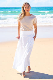 Model Cara wearing size 10 of the Timeless Love Cotton Maxi Skirt in colour White (White), from the front, showing the whole outfit