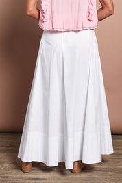 Model Riina wearing size 10 of the Timeless Love Cotton Maxi Skirt in colour White (White), from the back