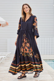 Model Tegand wearing size 10 of the With My Loves Folk Maxi Dress – Nightfolk in colour Nightfolk, from the front