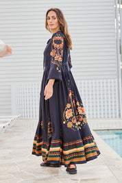 Model Tegand wearing size 10 of the With My Loves Folk Maxi Dress – Nightfolk in colour Nightfolk, from the front
