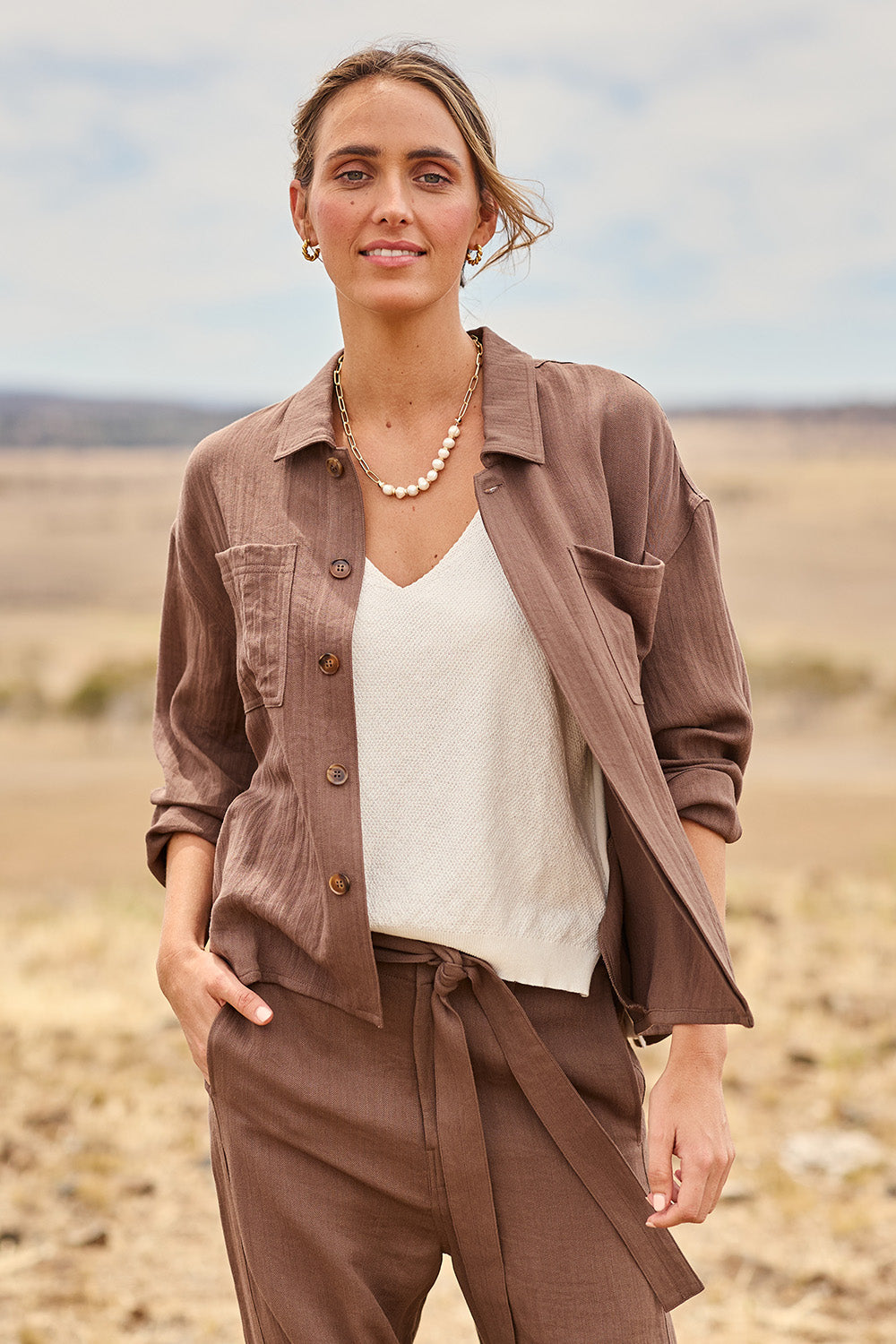 Model Tegan wearing size 10 of the For All The Days Soft Fall Jacket in colour Chocolate, from the front, showing the whole outfit