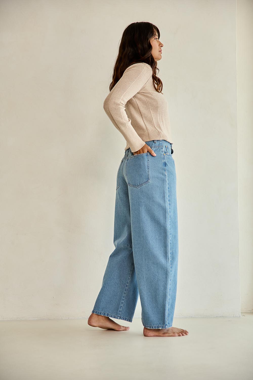 Model Tahnee wearing size 10 of the Dusk To Dawn Cotton  Slouch Barrel Jeans in colour Denim (Blue), from the front, showing the whole outfit