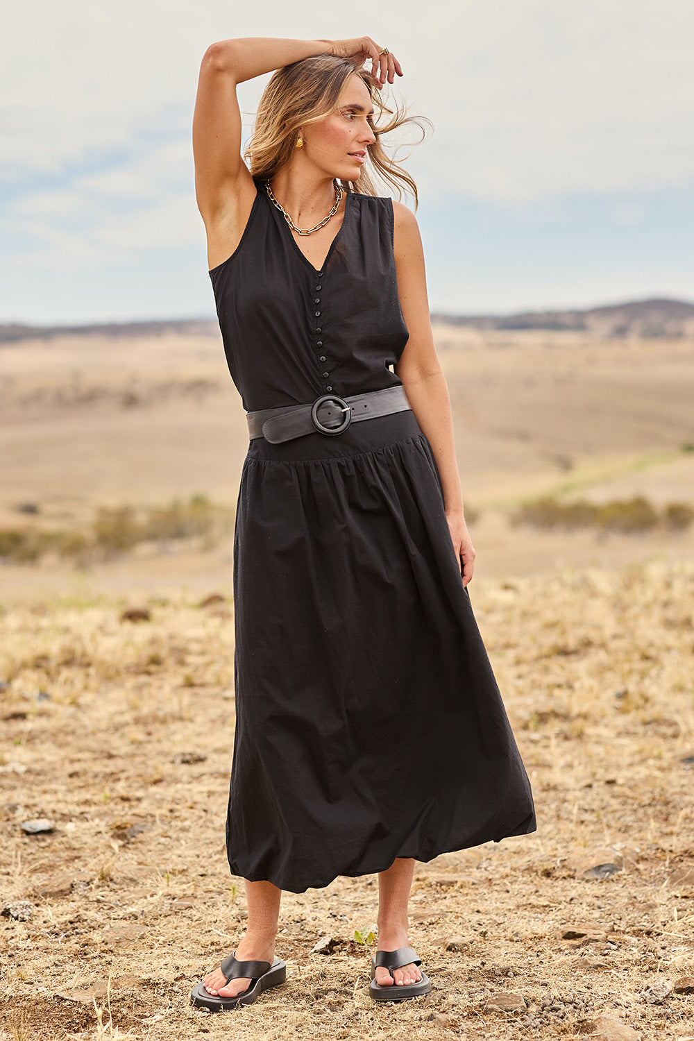 Model Tegan wearing size 10 of the Cute As A Button Cotton Tank in colour Black (Black), from the front, showing the whole outfit