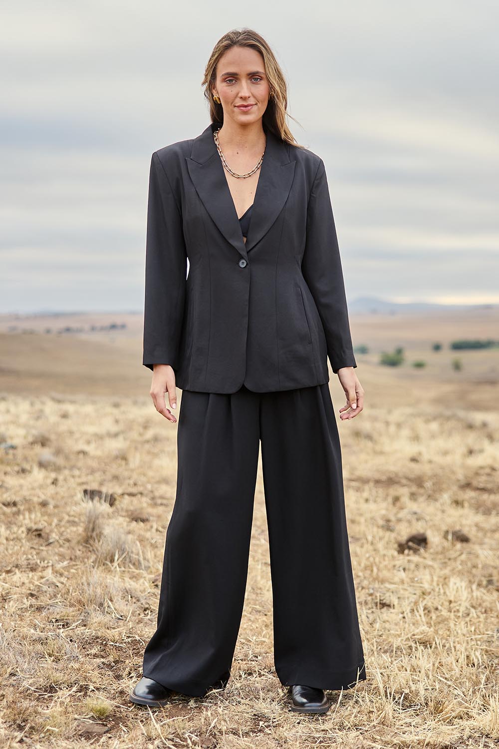 Model Tegan wearing size 10 of the All The Right Moves Blazer in colour Black (Black), from the front, showing the whole outfit
