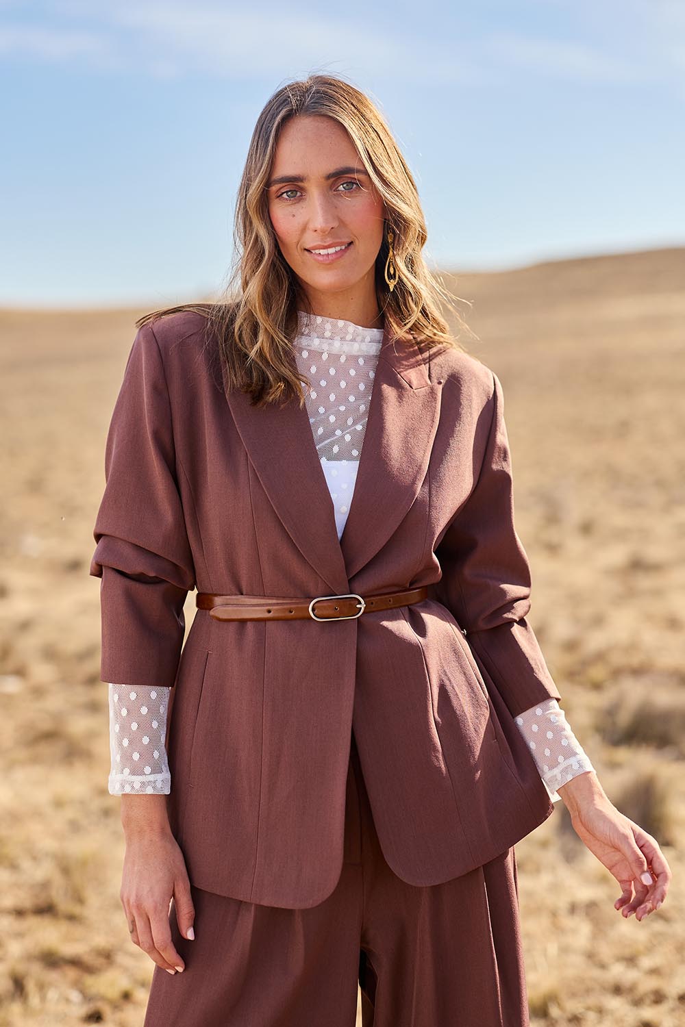 Model Tegan wearing size 10 of the All The Right Moves Blazer in colour Wood, from the front, showing the whole outfit