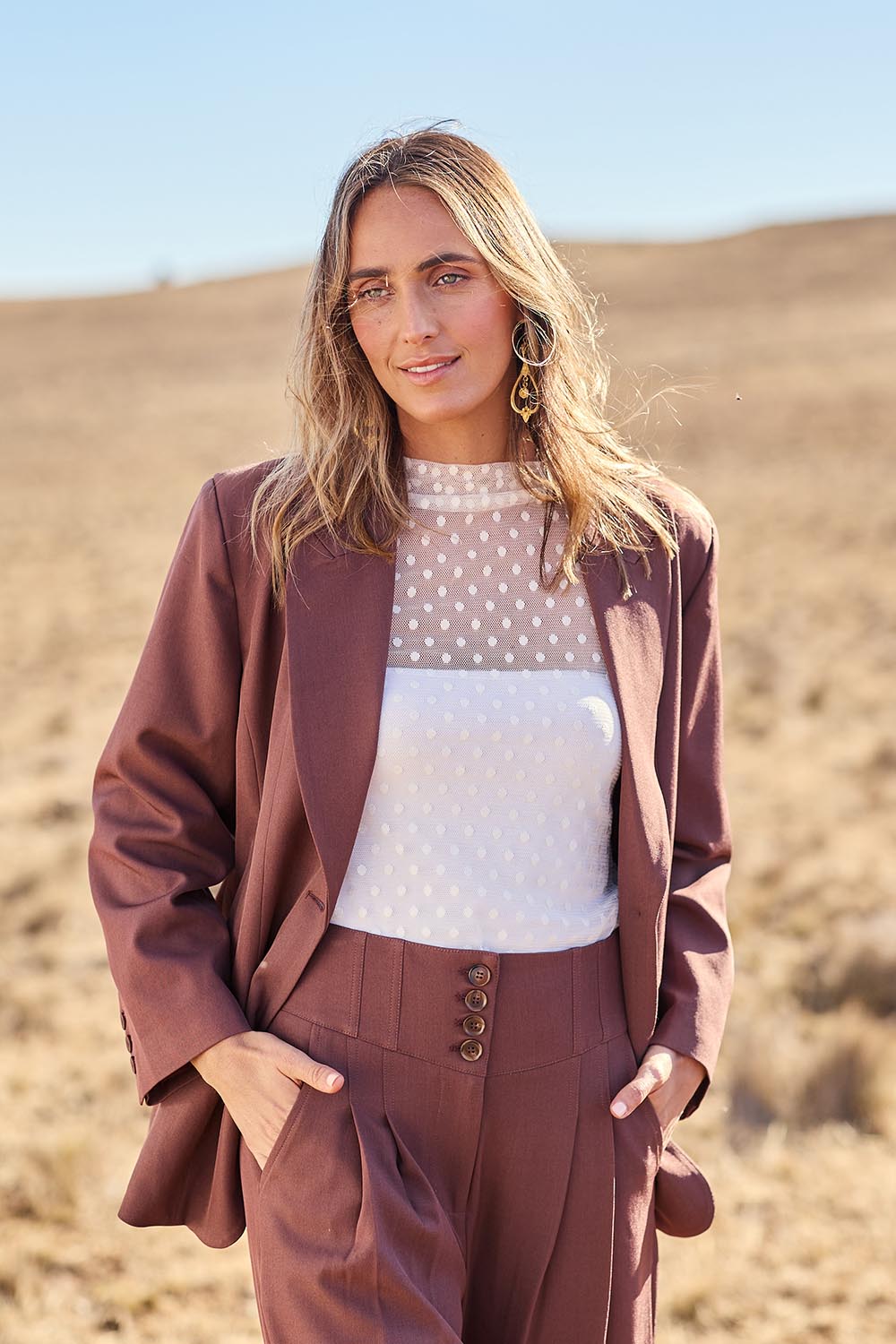Model Tegan wearing size 10 of the All The Right Moves Blazer in colour Wood, from the front, showing the whole outfit