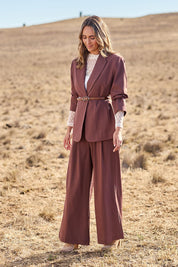 Model Tegan wearing size 10 of the All The Right Moves Blazer in colour Wood, from the front, showing the whole outfit