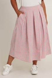 Model Ashleigh wearing size 16 of the Giddy For Gingham Cotton Blend Skirt in colour Rosecheck (Pink), from the front, cropped image