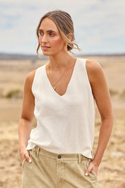 Model Tegan wearing size S of the Forever Yours Fine Cotton Knit Tank in colour Milk (White), from the front, cropped image