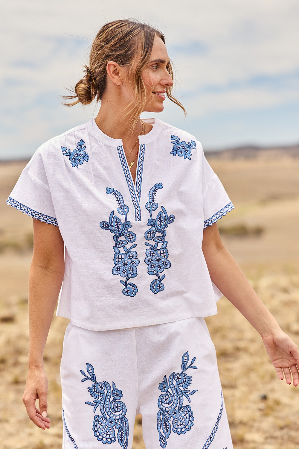 Model Tegan wearing size 10 of the Morning Sun Embroidered Cotton Top in colour Whiteblue (Blue), from the front, showing the whole outfit
